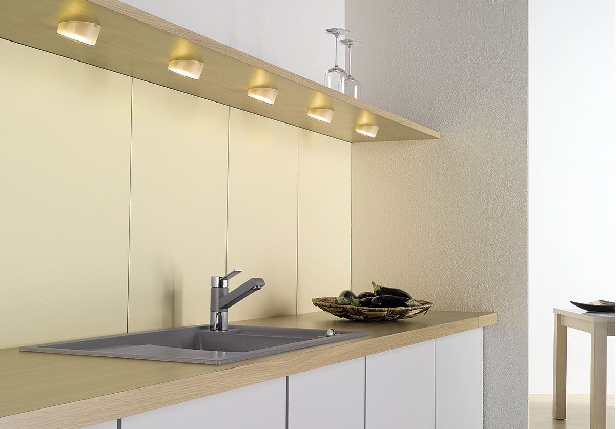 Adding lighting to the upper cabinets ensures plenty of light even in small kitchens.