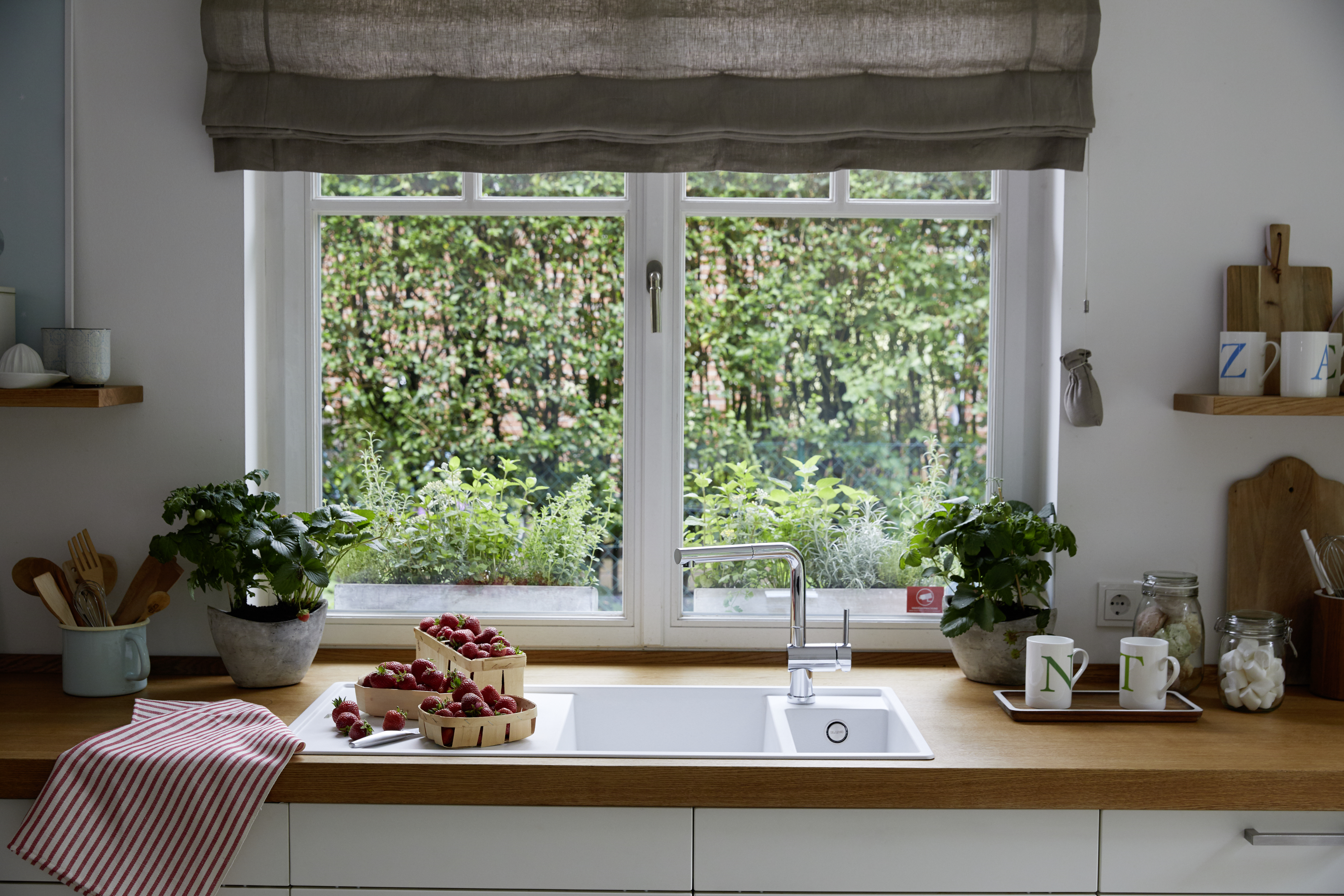 Make the most of the nicest place in the kitchen with a below-window mixer tap.